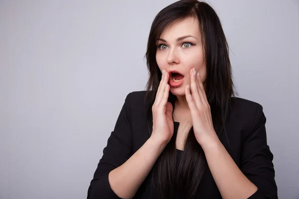 Young beautiful brunette shocked — Stock Photo, Image