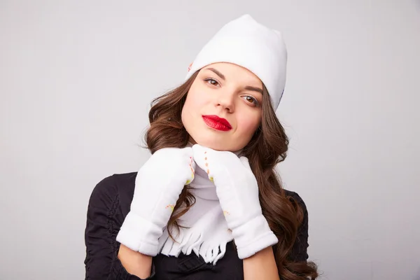 Girl in a white hat and scarf — Stock Photo, Image