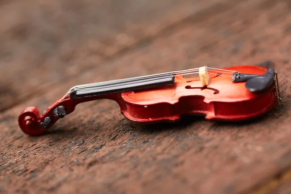 Violin on wooden board — Stock Photo, Image