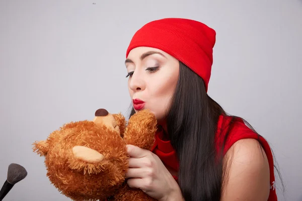 Brunette woman with teddy bear Royalty Free Stock Photos