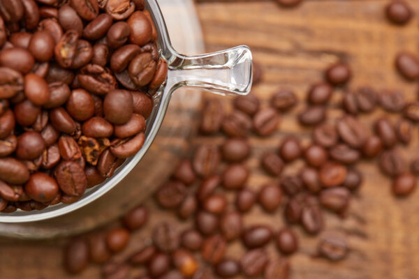 Fresh roasted coffee beans in cup 