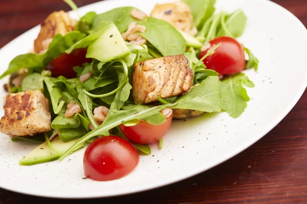 Salad with fish, arugula, cherry tomatoes