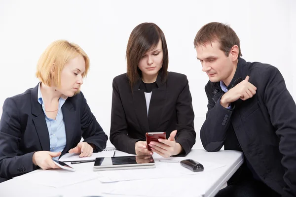 Three businesspeople working with tablet pc Stock Picture