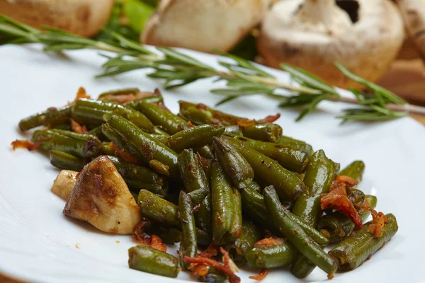 Tasty stewed green beans with mushrooms — Stock Photo, Image
