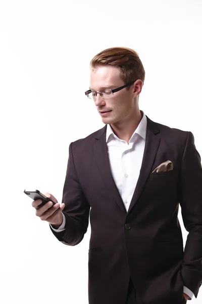 Joven hombre de negocios guapo con teléfono — Foto de Stock