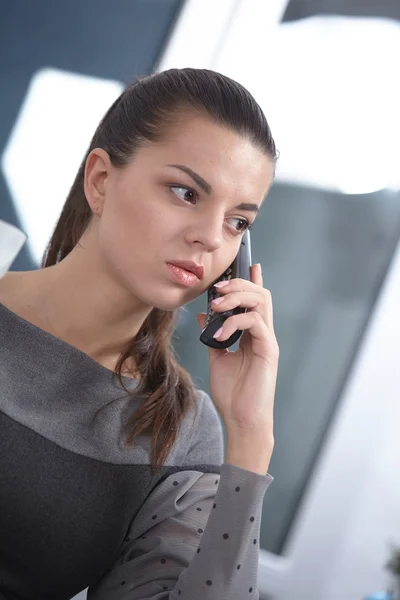 Business woman with a phone Stock Picture