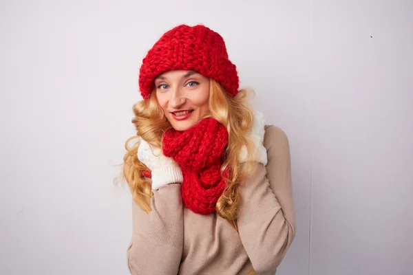 Blonde woman in red hat and scarf — Stock Photo, Image