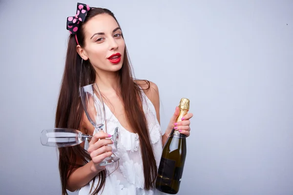 Beautiful girl with bottle of champagne — Stock Photo, Image