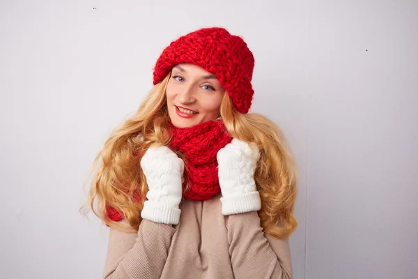 Blonde woman in red hat and scarf — Stock Photo, Image