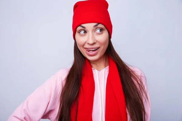 Beautiful girl in red hat and scarf — Stock Photo, Image