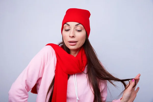 Beautiful girl in red hat and scarf — Stock Photo, Image