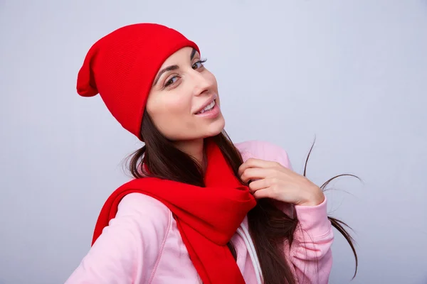 Beautiful girl in red hat and scarf — Stock Photo, Image