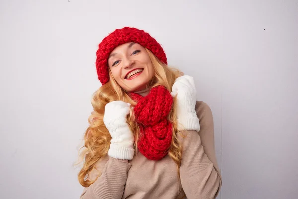 Blonde woman in red hat and scarf — Stock Photo, Image