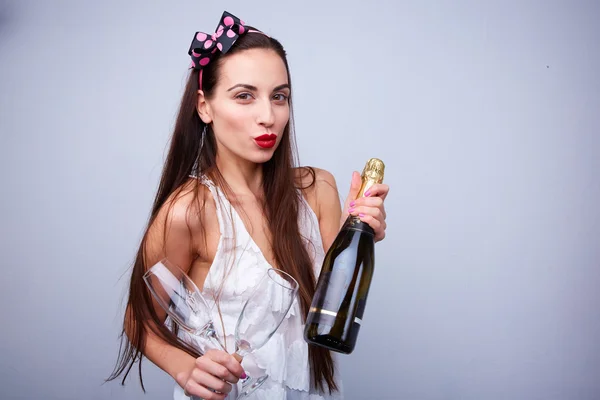 Beautiful girl with bottle of champagne — Stock Photo, Image