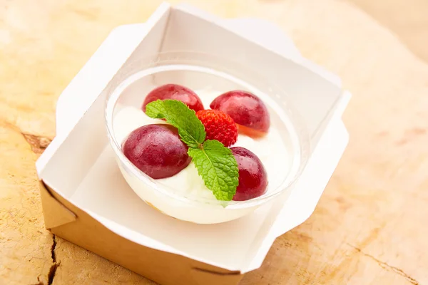 Curd dessert with grapes and strawberry — Stock Photo, Image