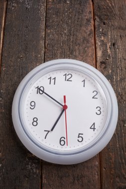 White clock on old wooden wall  clipart