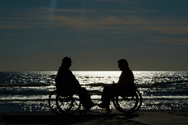 Two handicapped men in wheelchairs