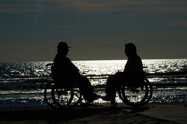 Two handicapped men in wheelchairs