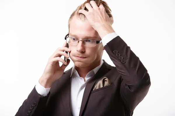 Hombre de negocios con teléfono en shock — Foto de Stock