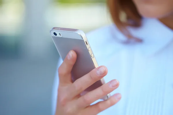 Female hand using phone — Stock Photo, Image