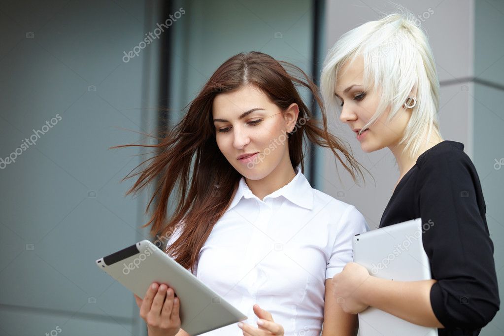 Businesswomen with digital gadgets