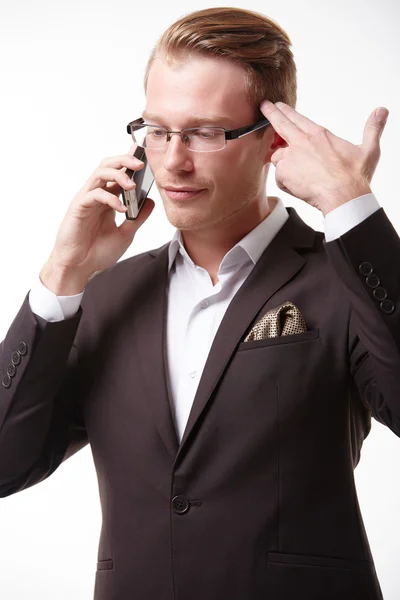 Chockad affärsman med telefonen — Stockfoto