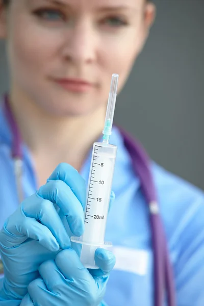 Female doctor with syringe — Stock Photo, Image