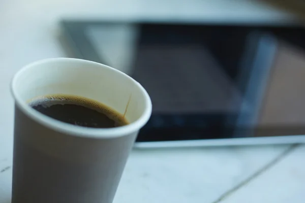 Cup of coffee in office — Stock Photo, Image