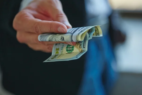 Businessman holding money — Stock Photo, Image