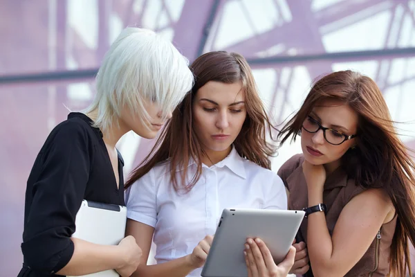 Group of businesswomen with digital gadgets Stock Picture