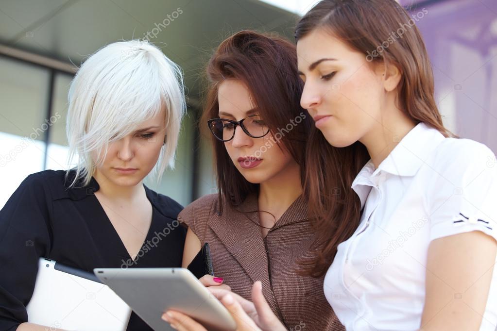 Group of businesswomen with digital gadgets 