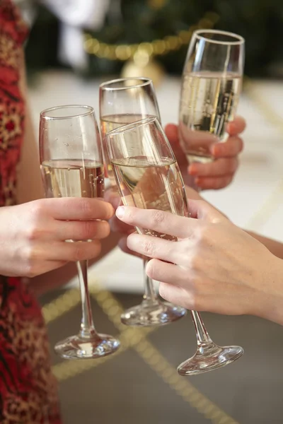 Glasses of champagne in female hands — Stock Photo, Image