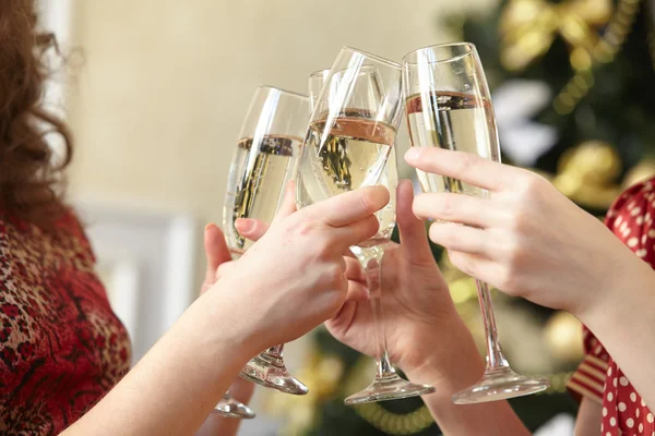 Female hands with champagne glasses — Stock Photo, Image