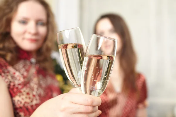 Female hands with champagne glasses — Stock Photo, Image