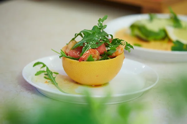 Salad in grapefruit peel — Stock Photo, Image