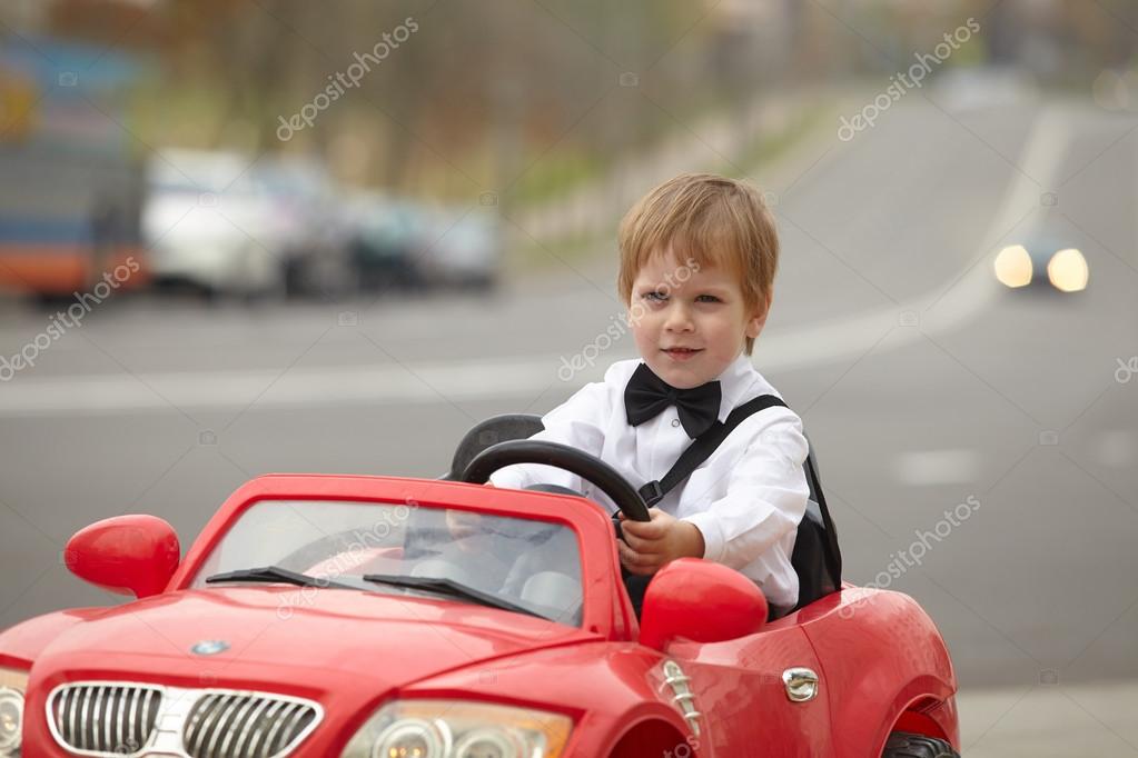 little boy driving