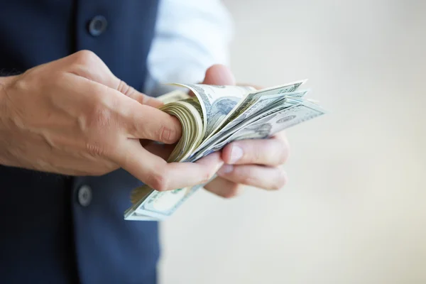 Businessman holding money — Stock Photo, Image