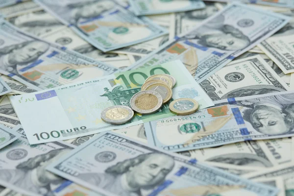 Dollars and euro coins — Stock Photo, Image