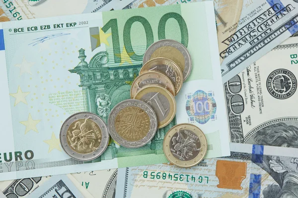 Dollars and euro coins — Stock Photo, Image