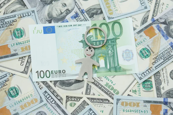 Dollars and euro and little man — Stock Photo, Image