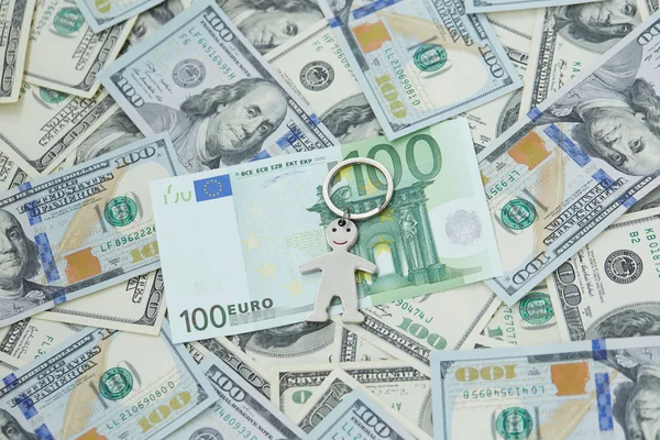 Dolar ve euro ve küçük adam — Stok fotoğraf