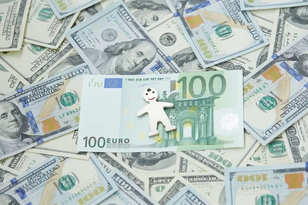 Dollars and euro and little man — Stock Photo, Image