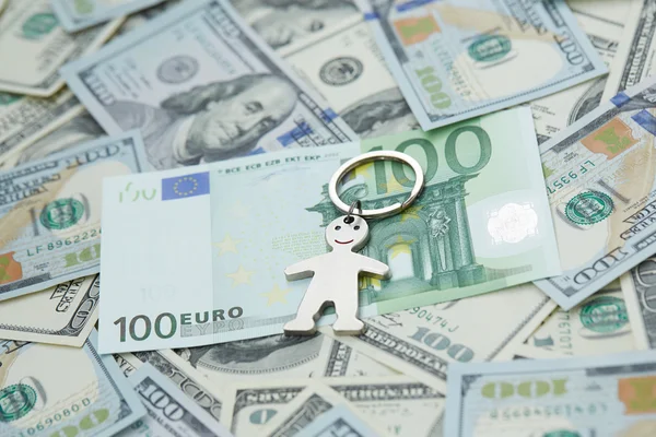 Dollars and euro and little man — Stock Photo, Image