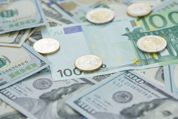 Dollars and euro coins — Stock Photo, Image