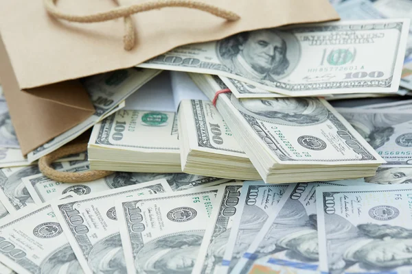 Money out of paper bag — Stock Photo, Image