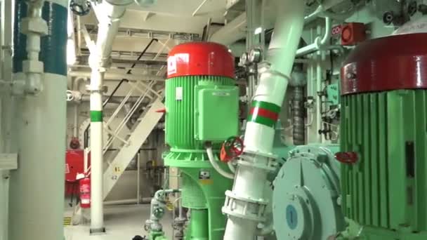 Compressors with pipelines stand in tanker machinery room — Stock Video