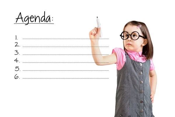 Cute little girl wearing business dress and writing blank agenda list. White background. — Stock Photo, Image