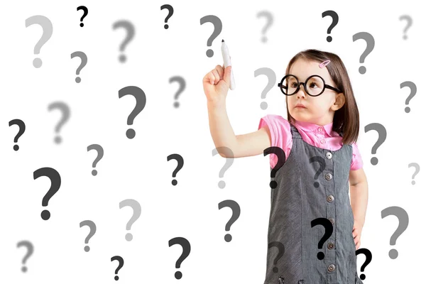 Cute little girl wearing business dress and writing question mark. White background. — Stock Photo, Image