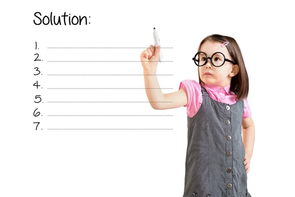 Cute little girl wearing business dress and writing blank solution list. White background. — Stock Photo, Image
