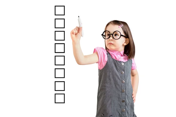 Cute little girl wearing business dress and writing on some blank checklist boxes. White background. Stock Image